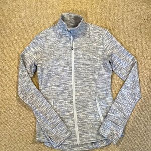 Define Jacket with contoured fit. Thumb holes with secure front pockets.